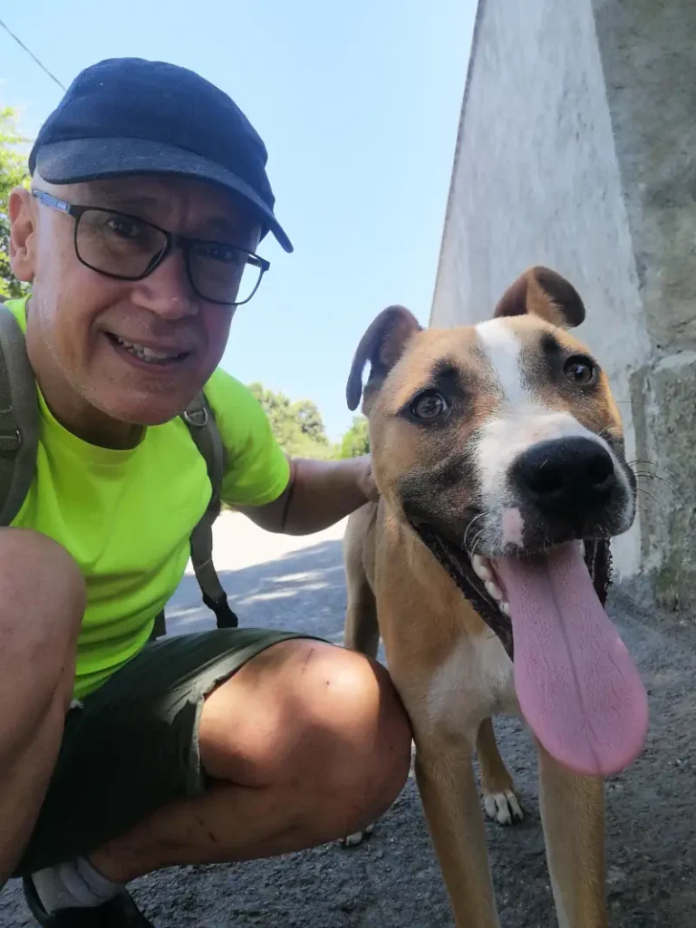 Özgür Nevres with a rescue dog. I engage in the compassionate act of providing food and assistance to stray cats and dogs, offering them nourishment and aid. This effort supports these vulnerable animals, helping to improve their living conditions and well-being, reflecting a commitment to the care and welfare of animals in need.