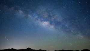 Science: A Candle in the dark. Stars and milky way in the beautiful night sky