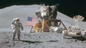 Moon Landing: Apollo 15 Astronaut James Irwin gives salute beside U.S. flag during EVA
