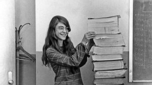 Margaret Hamilton in 1969, when she was the lead software engineer of the Apollo Project. She is standing next to a huge stack of code she and her MIT team produced for the Apollo project.