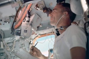 U.S. astronaut Walter Cunningham writes with a Fisher Space Pen during the flight of Apollo 7